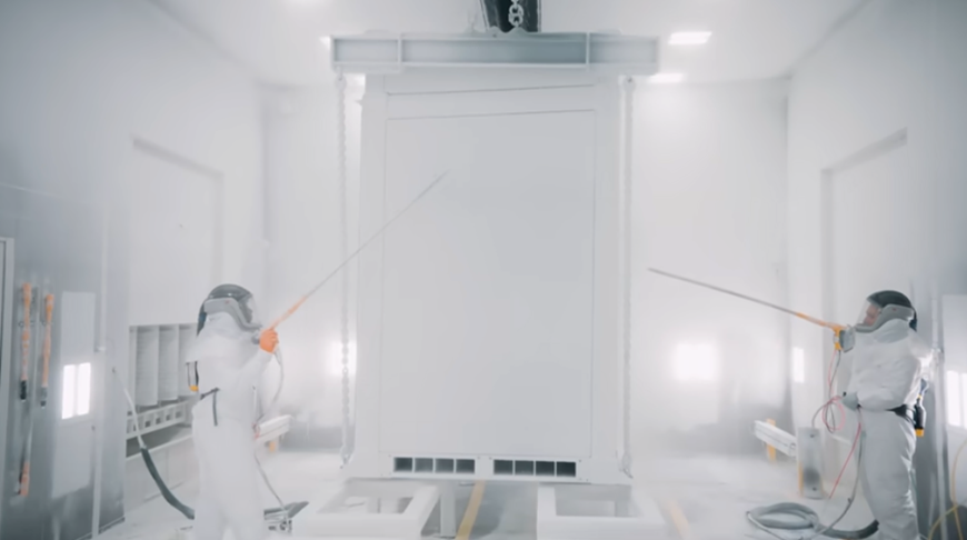 A person in a white suit painting a door

AI-generated content may be incorrect.